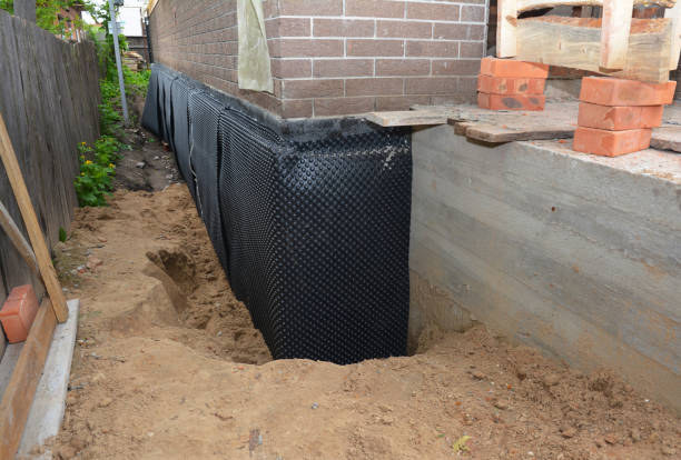 SJ Waterproofing Pros technician performing targeted Emergency Waterproofing assessment in Saint James, NY